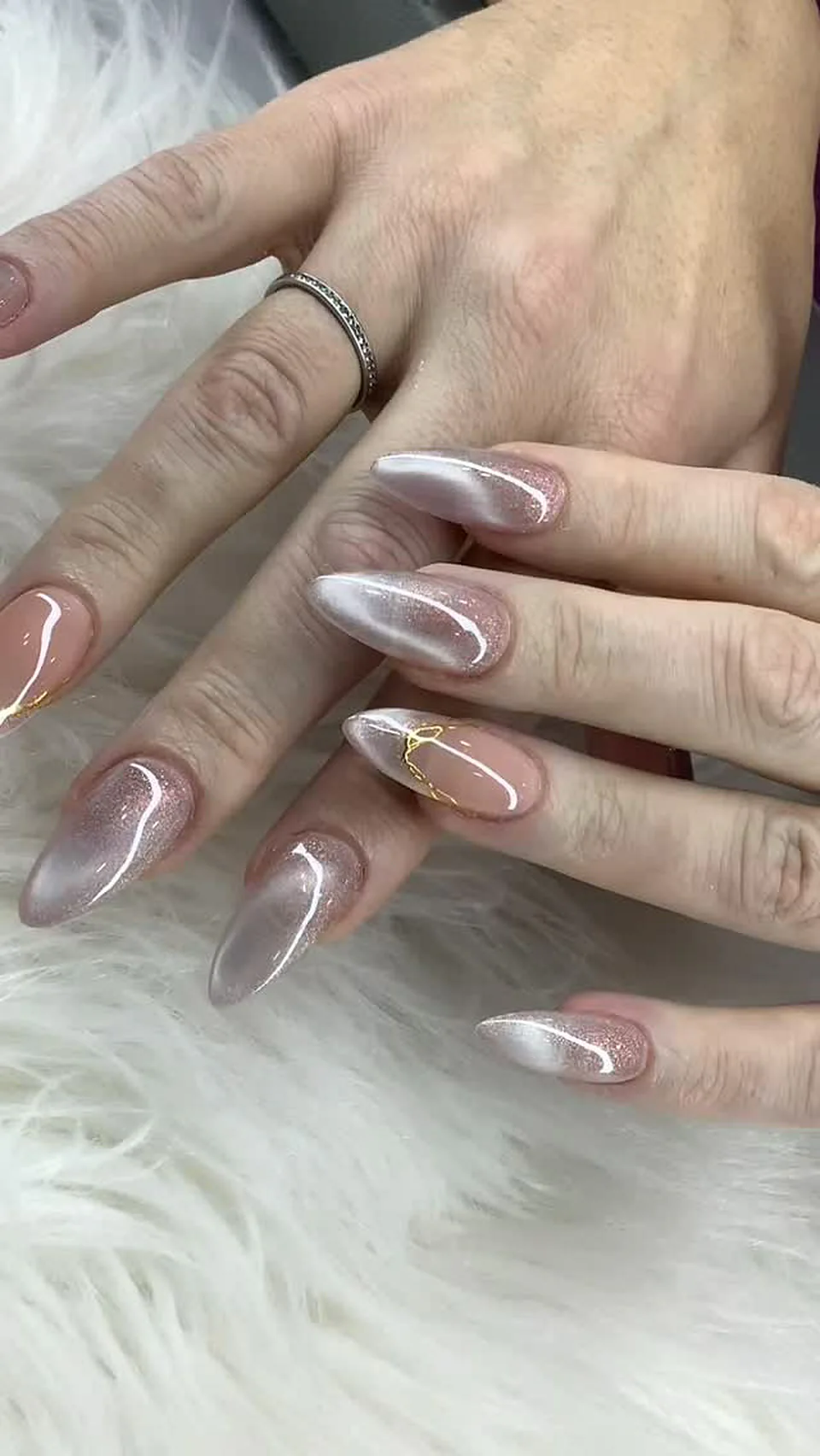 Pearl chrome gel nails with a soft swirl finish done at Attraction Nails Salon, Roselle Park NJ