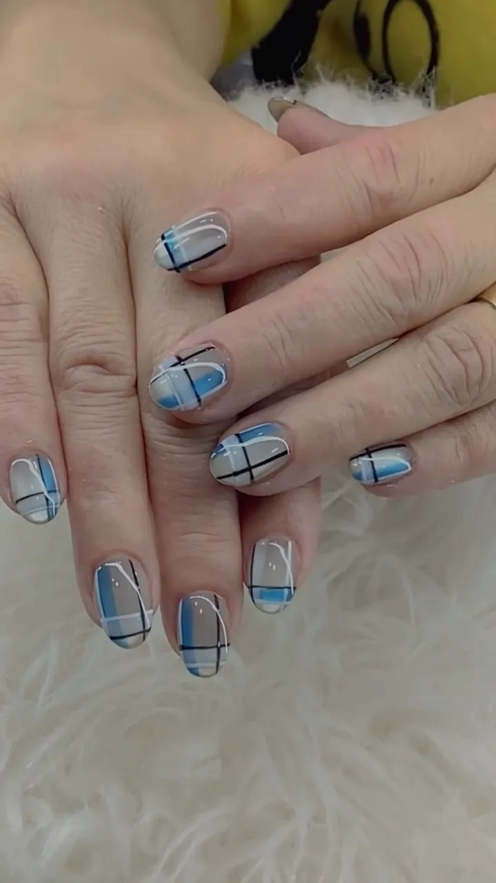 Video of light blue plaid nail art