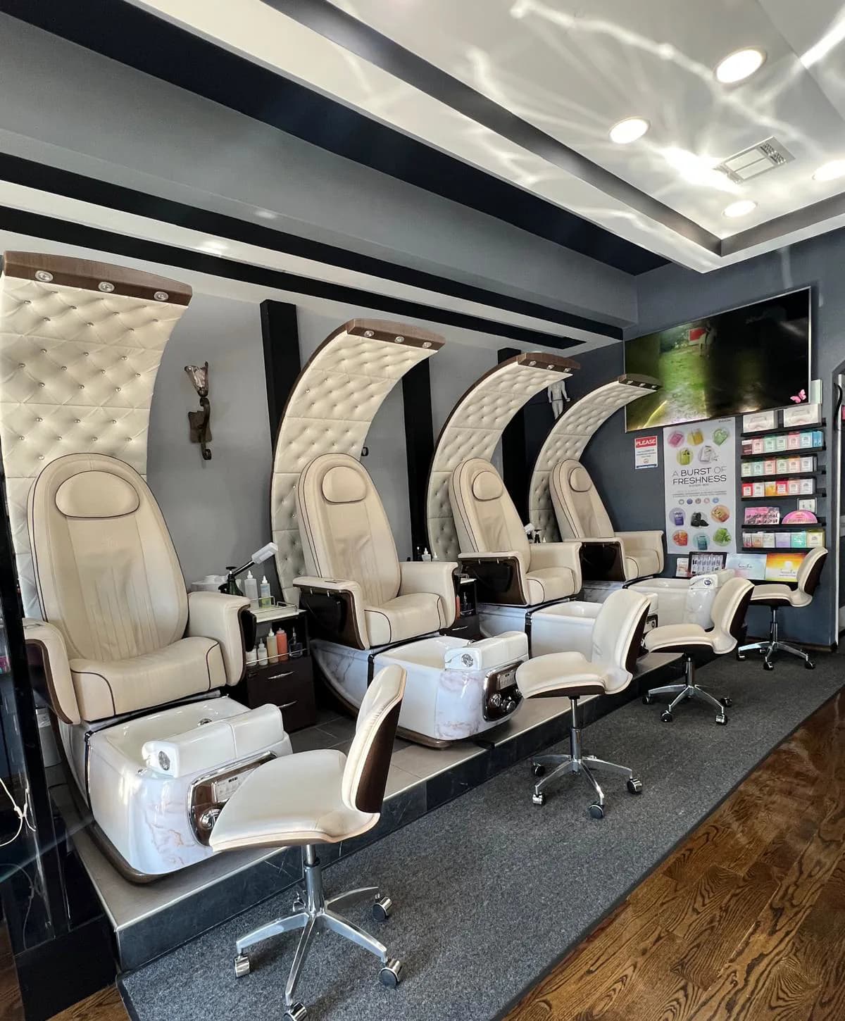 Row of spa pedicure chairs at Attraction Nails Salon in Roselle Park, NJ